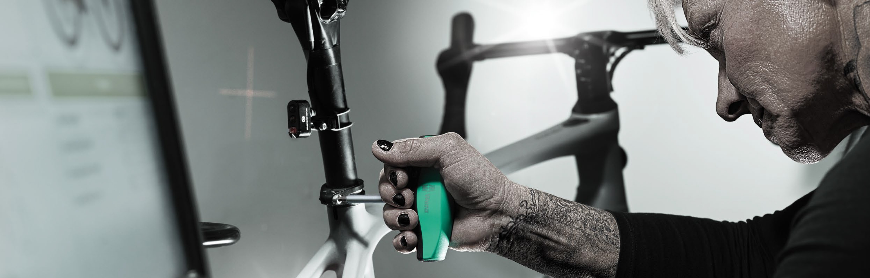 Close-up of the Wera 400 Hex Torque Indicator adjusting a bike saddle.