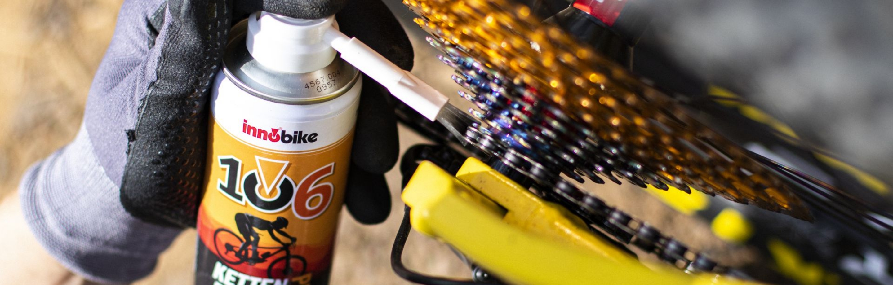 Innobike 106 chain spray being applied to a clean bicycle chain.