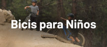Bicicletas para niños Giant Niños subiendo una montaña de arena con bicicletas de montaña