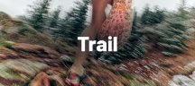 A runner in Altra trail shoes in a forest.