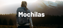 Mochilas: excursionista de espaldas con mochila de senderismo VAUDE gris frente a montañas nevadas