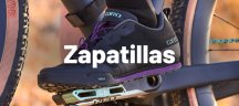 Zapatillas de ciclismo de la marca Giro negras con detalles en violeta y verde