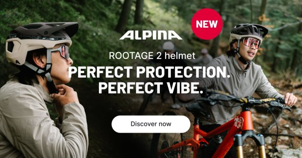 A mountain bike rider tests the Alpina Rootage 2 helmet in the woods.