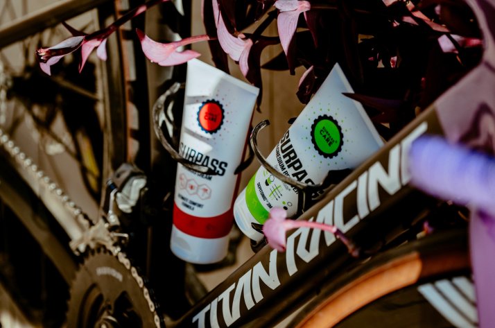 What's in the SURPASS formulas A close-up image of SURPASS creams on a road bike