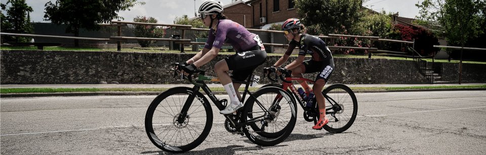 Cyclists riding road bikes in NIMBL cycling shoes